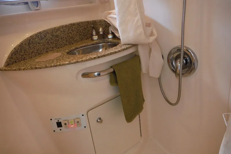Slide: The Image of 2005 Chaparral Signature 350 bathroom with granite countertop and stainless steel sink. - 26