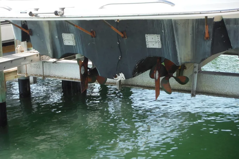 Slide: The Image of 2005 Chaparral Signature 350 boat propellers above water on a lift. - 44