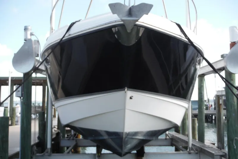 Slide: The Image of 2005 Chaparral Signature 350 boat docked, front view, in a marina setting. - 48