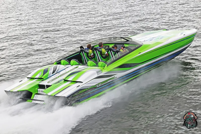 Slide: The Image of High-speed Skater 388 powerboat, 2025 model, in vibrant green and white, cruising on water. - 35