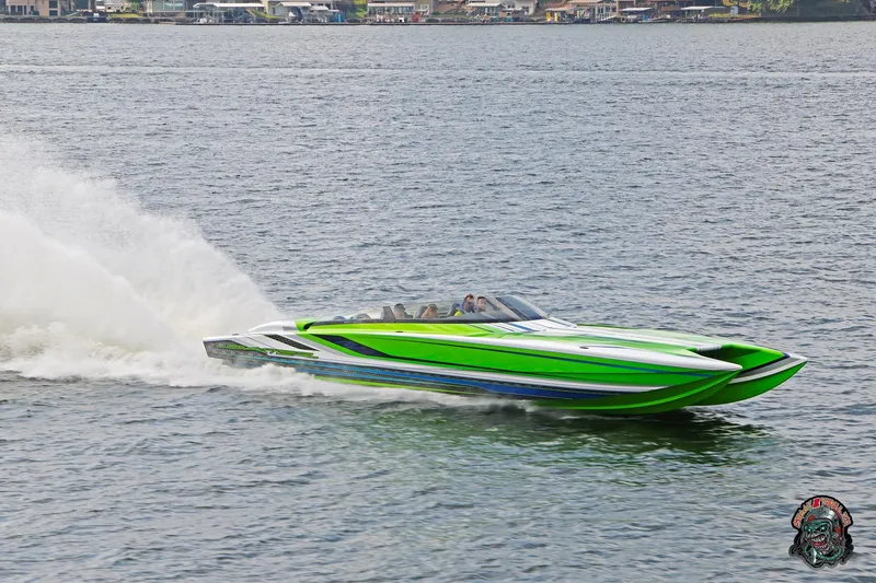 Slide: The Image of High-speed green Skater 388 powerboat cruising on a lake, 2025 model. - 28