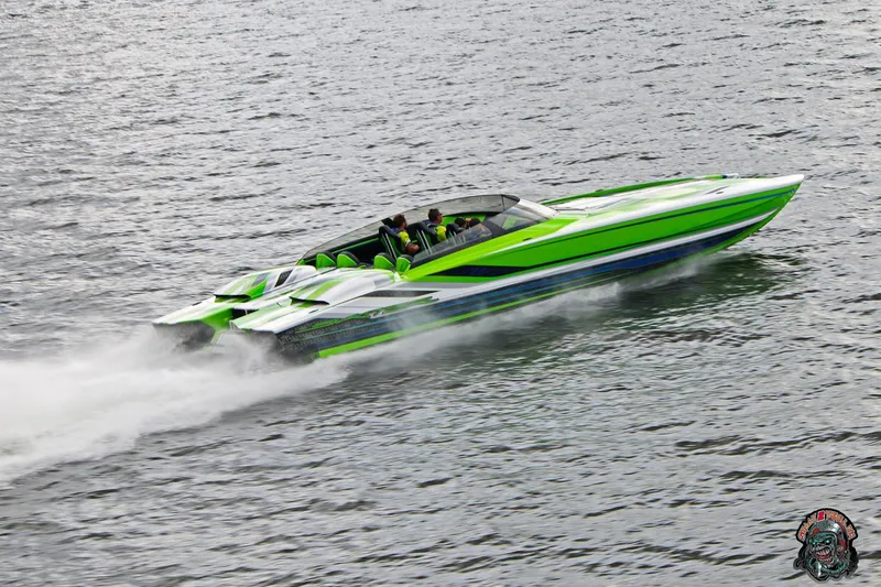 Slide: The Image of High-speed Skater 388 powerboat in vibrant green, cruising on water, 2025 model. - 32