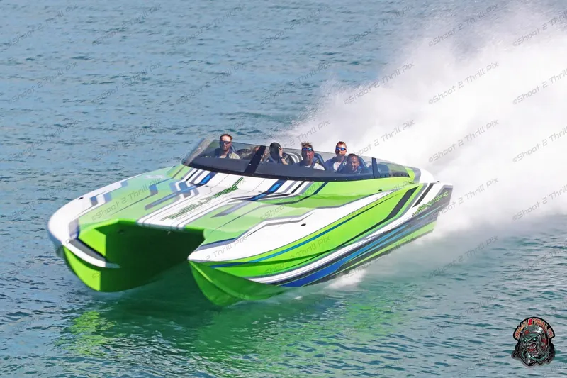 Slide: The Image of High-speed Skater 388 powerboat from 2025, featuring vibrant green and white design on water. - 21