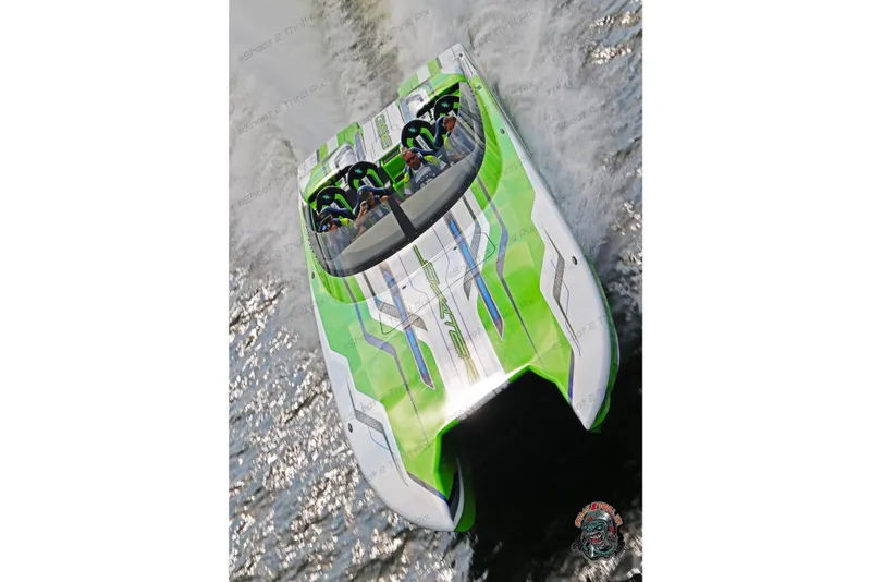 Slide: The Image of High-speed Skater 388 boat from 2025, featuring vibrant green and white design on water. - 6