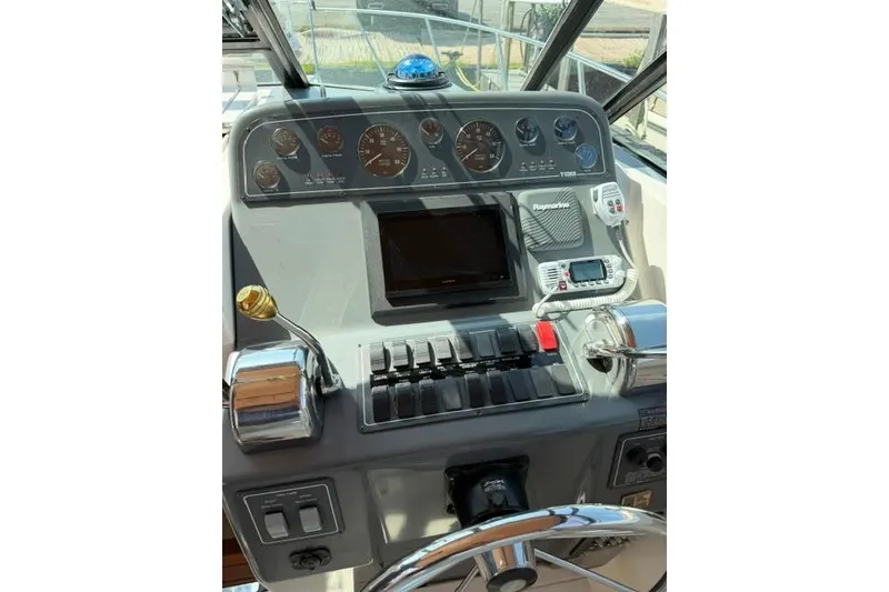 Slide: The Image of Control panel of a 2002 Tiara 29 boat with gauges and navigation equipment. - 15