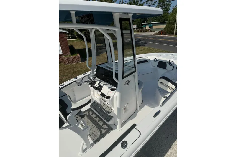 Slide: The Image of 2027 Tidewater 220 LXF boat interior with modern helm and seating. - 11
