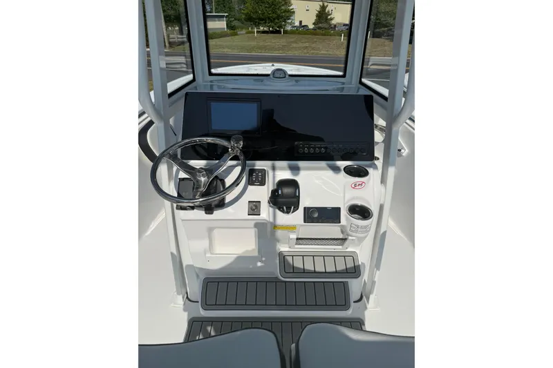 Slide: The Image of Helm of 2027 Tidewater 220 LXF boat with steering wheel and control panel. - 9