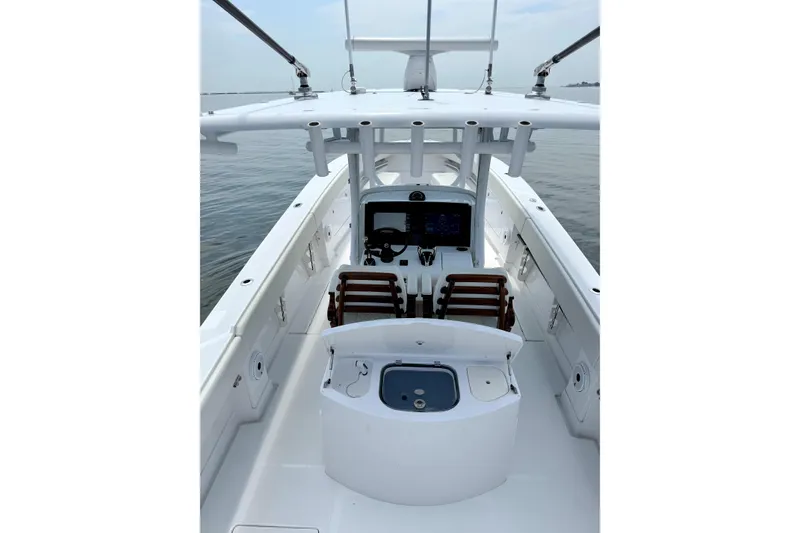 Slide: The Image of 2021 Jupiter 38 HFS boat interior with helm, seating, and ocean view. - 5