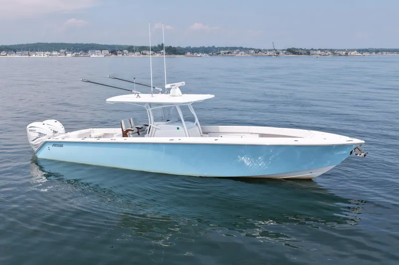 The Image of 2021 Jupiter 38 HFS boat on calm water, featuring sleek design and twin engines. - 0