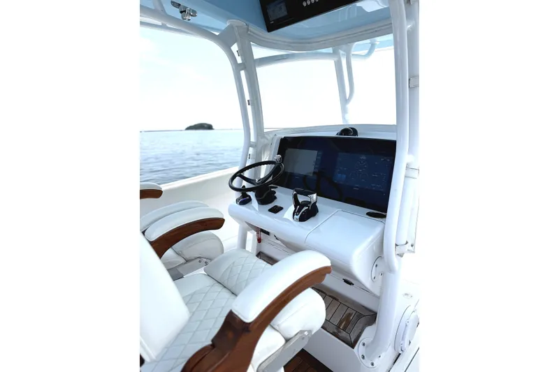 Slide: The Image of 2021 Jupiter 38 HFS boat helm with modern controls and luxurious seating. - 6