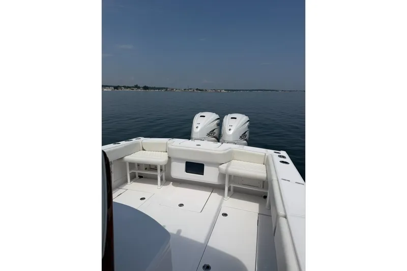 Slide: The Image of 2021 Jupiter 38 HFS boat with twin engines on calm water. - 13
