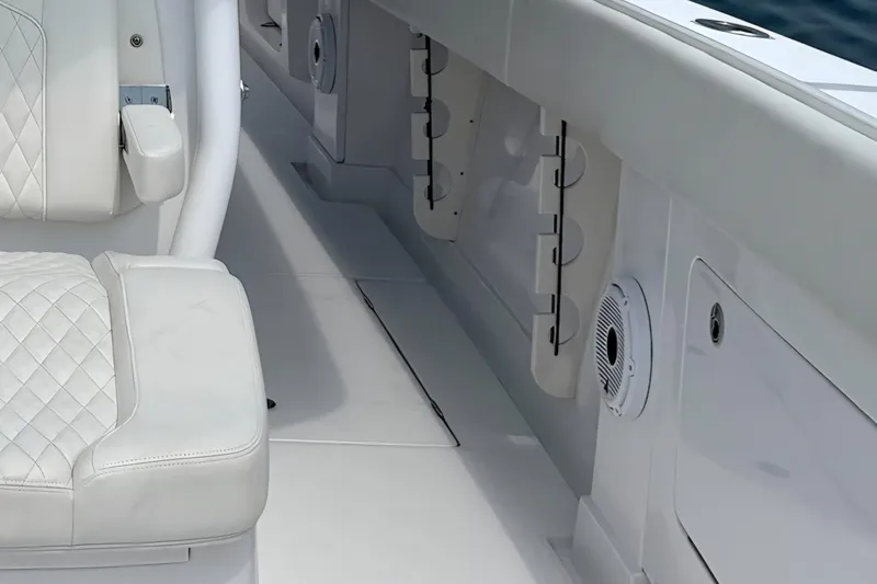 Slide: The Image of Luxurious interior of 2021 Jupiter 38 HFS boat with white seating and speaker. - 12