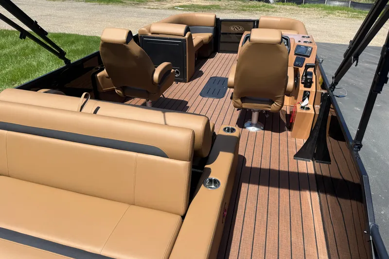 Slide: The Image of 2026 Bentley Pontoons Legacy 223 Swingback interior with tan leather seating and modern dashboard. - 25