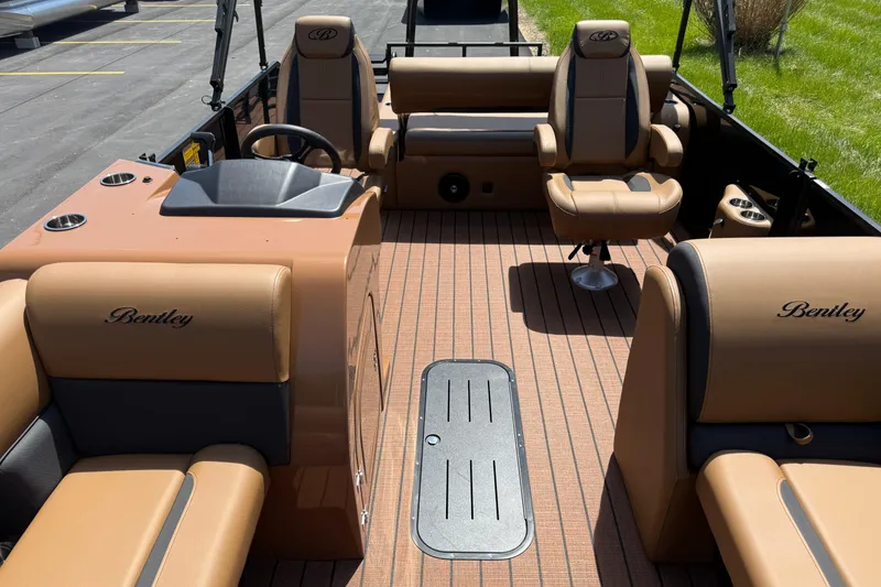 Slide: The Image of 2026 Bentley Pontoons Legacy 223 Swingback interior with luxurious tan seating and sleek design. - 9