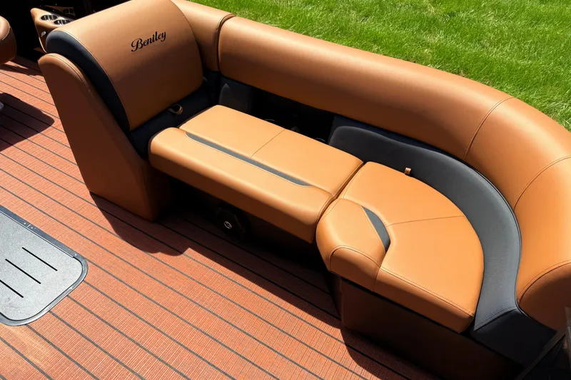 Slide: The Image of Luxurious seating on 2026 Bentley Pontoons Legacy 223 Swingback, featuring elegant tan upholstery. - 13