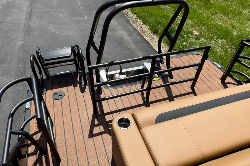 Slide: The Image of 2026 Bentley Pontoons Legacy 223 Swingback deck with seating and railing, showcasing luxury design. - 23