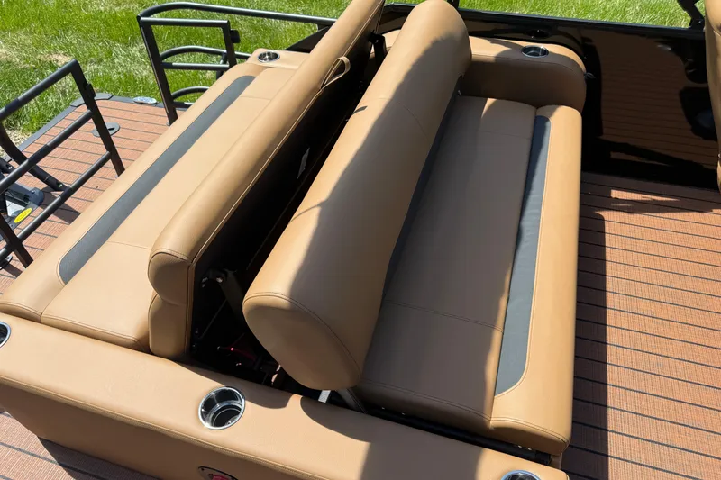 Slide: The Image of 2026 Bentley Pontoons Legacy 223 Swingback with tan leather seating and cup holders. - 22