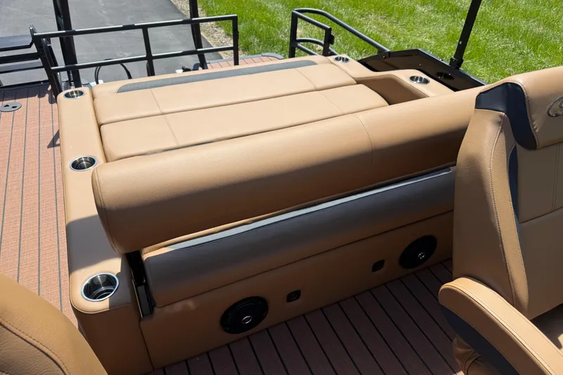 Slide: The Image of 2026 Bentley Pontoons Legacy 223 Swingback with tan seating and integrated cup holders. - 19