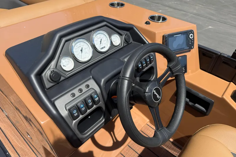 Slide: The Image of Steering console of 2026 Bentley Pontoons Legacy 223 Swingback with gauges and controls. - 18