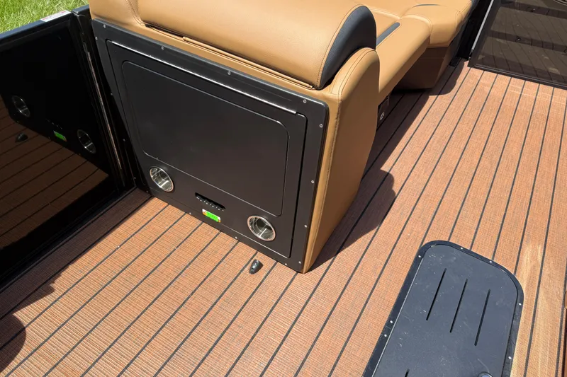 Slide: The Image of 2026 Bentley Pontoons Legacy 223 Swingback interior with tan seating and wood-style flooring. - 11