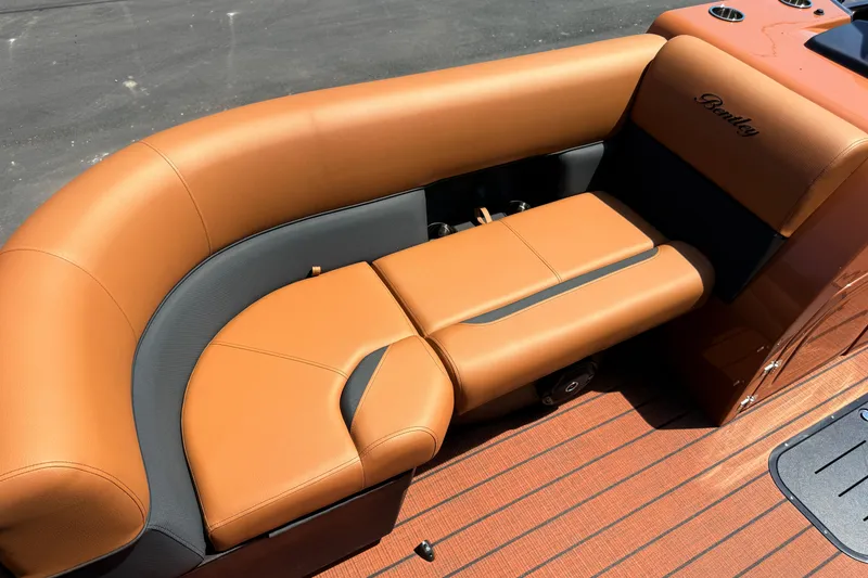 Slide: The Image of 2026 Bentley Pontoons Legacy 223 Swingback with luxurious tan seating and sleek design. - 12