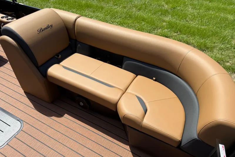 Slide: The Image of 2026 Bentley Pontoons Legacy 223 Swingback tan leather seating on a pontoon boat. - 8