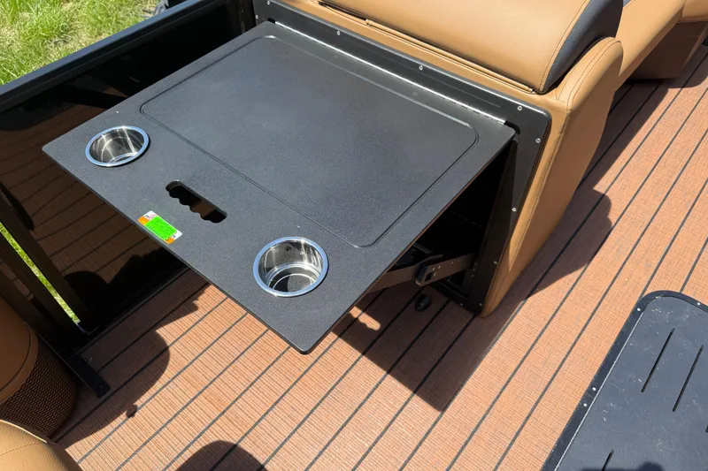 Slide: The Image of 2026 Bentley Pontoons Legacy 223 Swingback with fold-out table and cup holders on deck. - 14