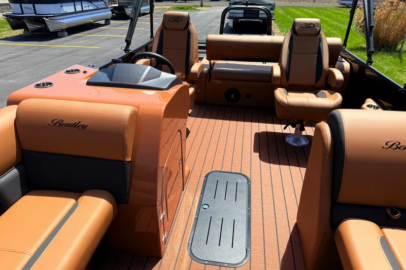 Slide: The Image of 2026 Bentley Pontoons Legacy 223 Swingback interior with luxurious tan seating and sleek design. - 5