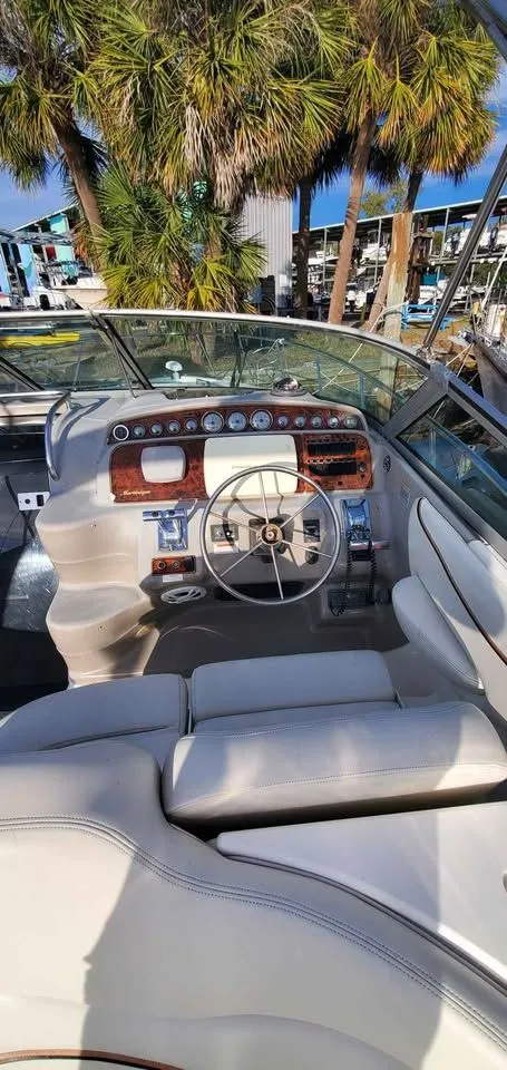 Slide: The Image of The image shows the cockpit of a 2002 Wellcraft 3300 Martinique with a sleek dashboard. - 9