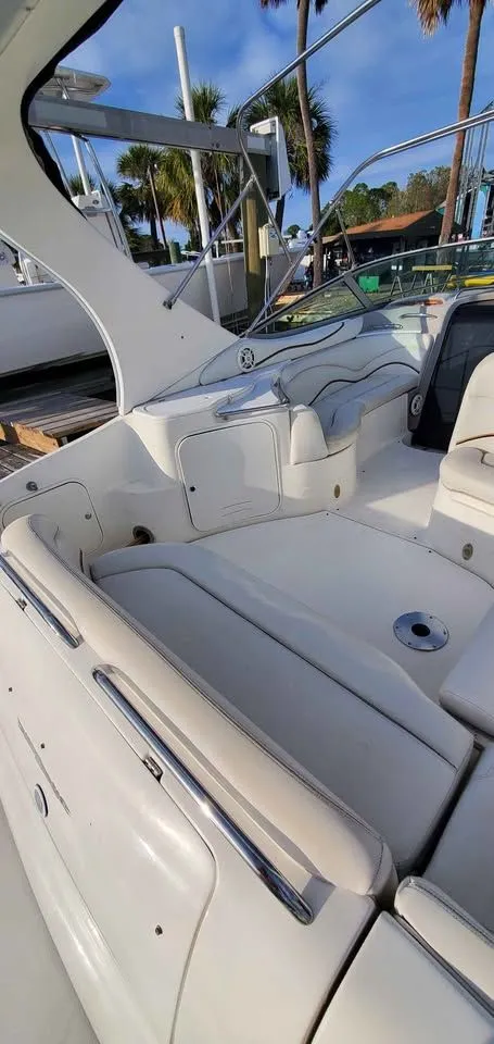 Slide: The Image of The image shows the cockpit of a 2002 Wellcraft 3300 Martinique with white seating. - 8