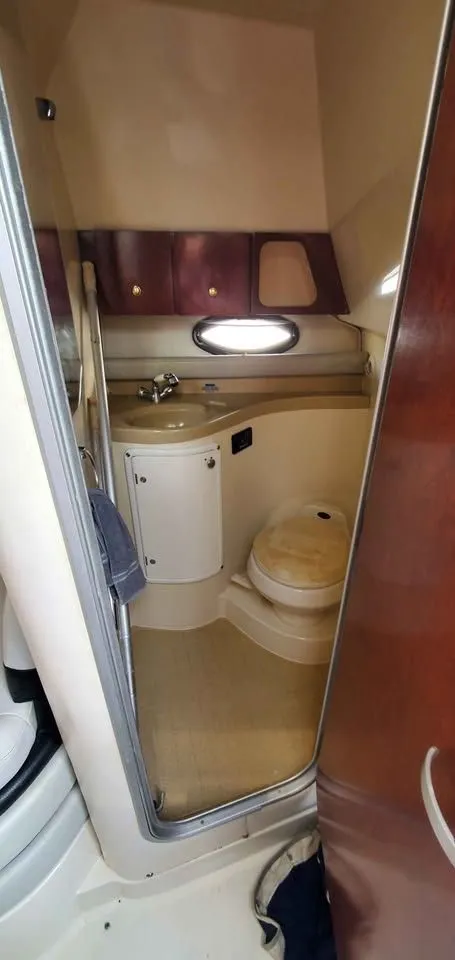 Slide: The Image of Interior of the 2002 Wellcraft 3300 Martinique with sink and toilet. - 15
