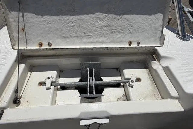Slide: The Image of Open anchor compartment on a 2000 Robalo 1820 Center Console boat. - 6