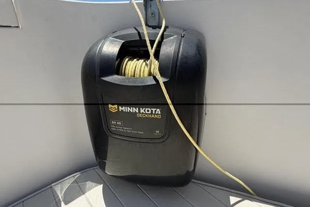 Slide: The Image of Minn Kota Deckhand anchor winch on 2000 Robalo 1820 Center Console boat. - 5