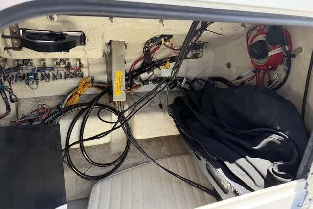 Slide: The Image of Interior wiring of a 2000 Robalo 1820 Center Console boat, showcasing cables and components. - 20