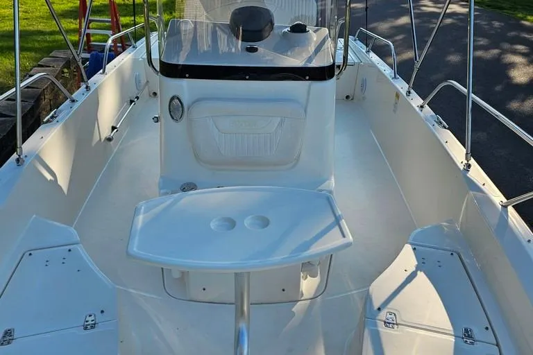 Slide: The Image of 2011 Boston Whaler 230 Dauntless boat interior with console and seating. - 14