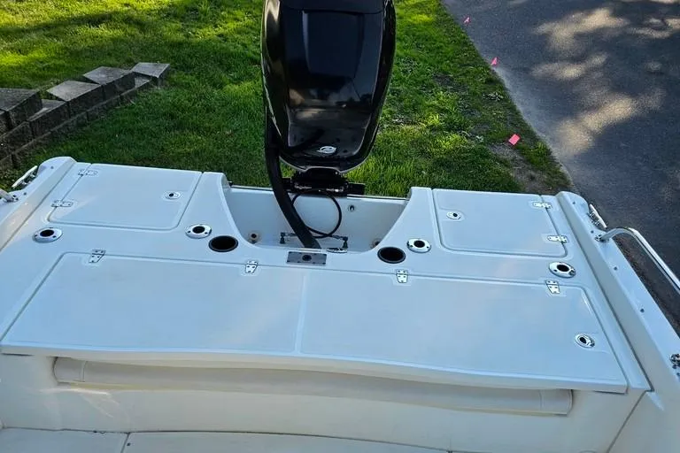 Slide: The Image of 2011 Boston Whaler 230 Dauntless boat with outboard motor, viewed from the rear deck. - 16