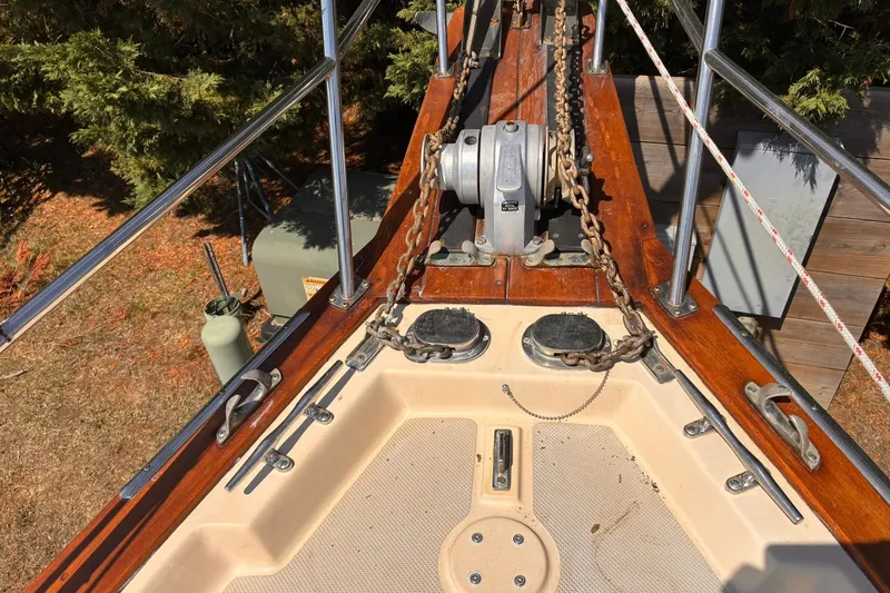 Slide: The Image of Bow of a 1991 Island Packet 29 sailboat with anchor chain and winch. - 9