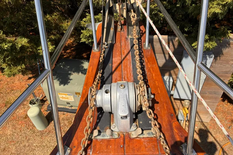 Slide: The Image of Bow of 1991 Island Packet 29 sailboat with anchor windlass and chains. - 8