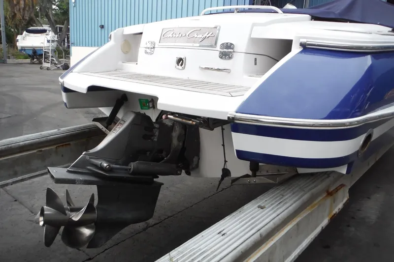 Slide: The Image of 2008 Chris-Craft Launch 25 boat, rear view with propeller, docked on a trailer. - 6