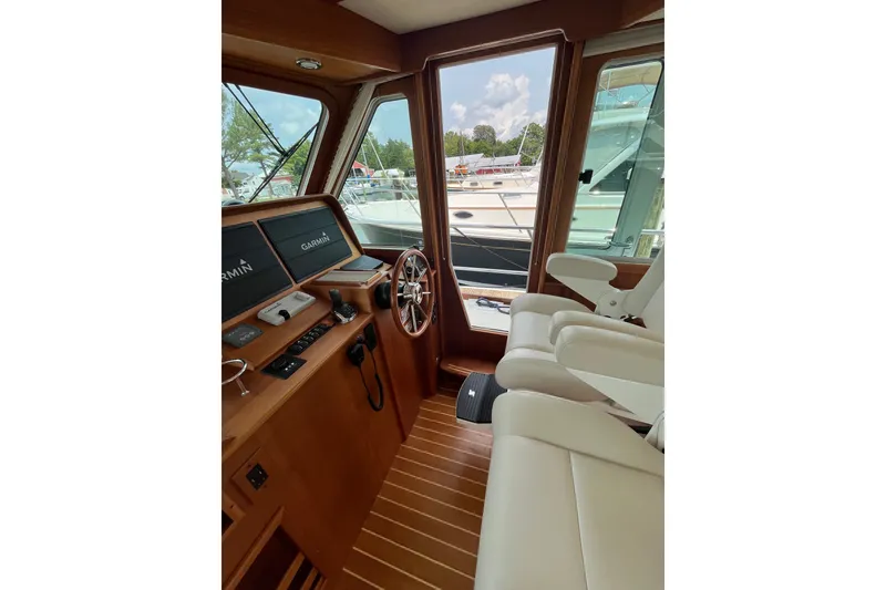 Slide: The Image of Interior view of 2018 Sabre 42 Fly Bridge Sedan with helm and seating. - 24