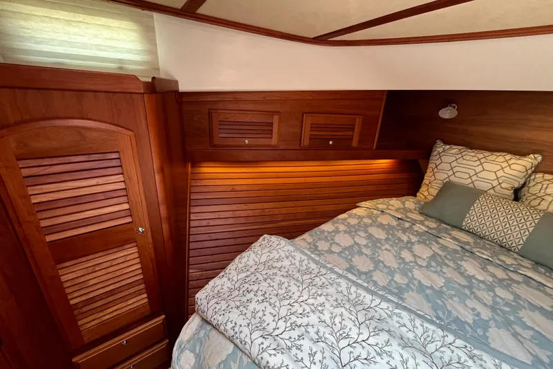 Slide: The Image of Luxurious cabin interior of 2018 Sabre 42 Fly Bridge Sedan with elegant wood finish. - 36