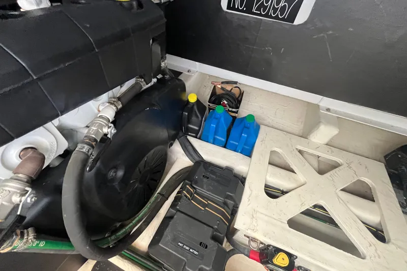 Slide: The Image of Engine compartment of a 2018 Sabre 42 Fly Bridge Sedan with maintenance supplies. - 43