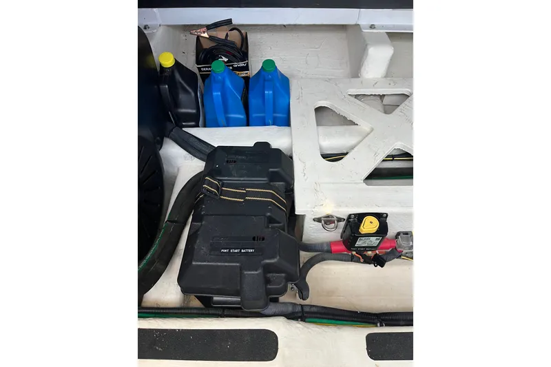 Slide: The Image of Engine compartment of 2018 Sabre 42 Fly Bridge Sedan with battery and fluid containers. - 46