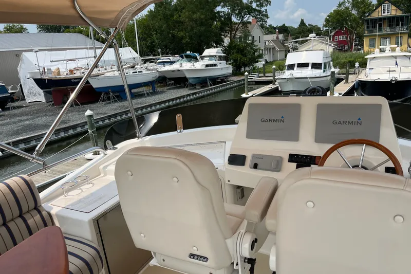 Slide: The Image of Flybridge view of 2018 Sabre 42 Fly Bridge Sedan with Garmin navigation displays. - 14