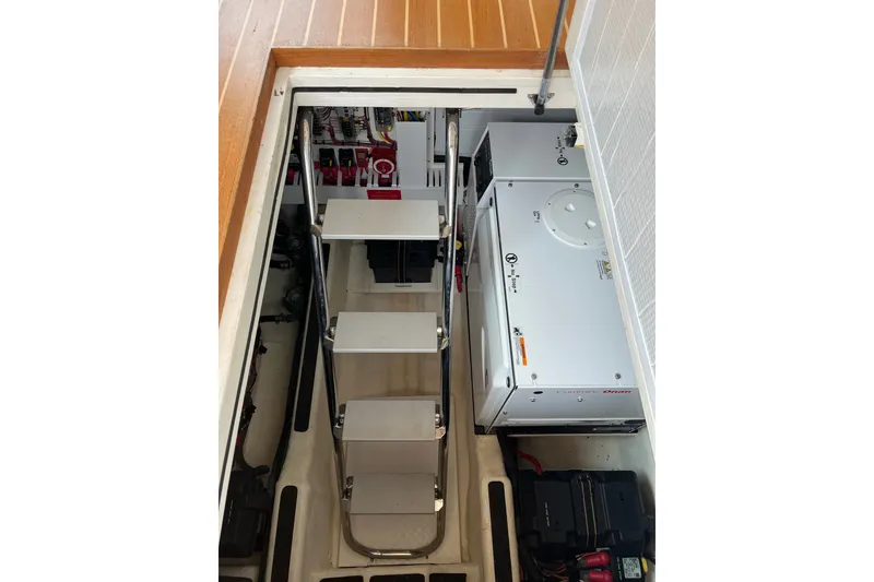 Slide: The Image of Engine room of 2018 Sabre 42 Fly Bridge Sedan with generator and electrical components. - 38