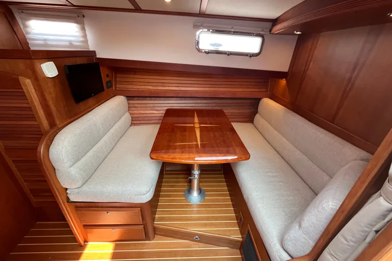 Slide: The Image of Luxurious interior of 2018 Sabre 42 Fly Bridge Sedan with elegant wood finish and cozy seating. - 29