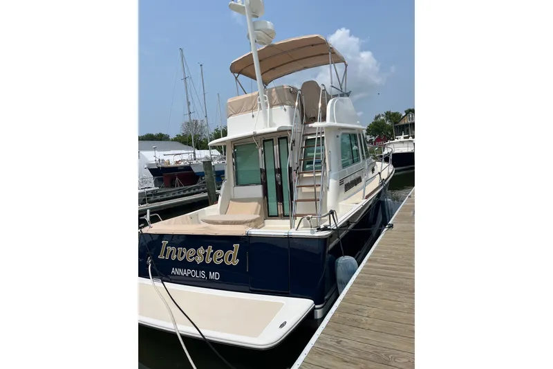 Slide: The Image of 2018 Sabre 42 Fly Bridge Sedan docked in Annapolis, MD, with beige canopy. - 5