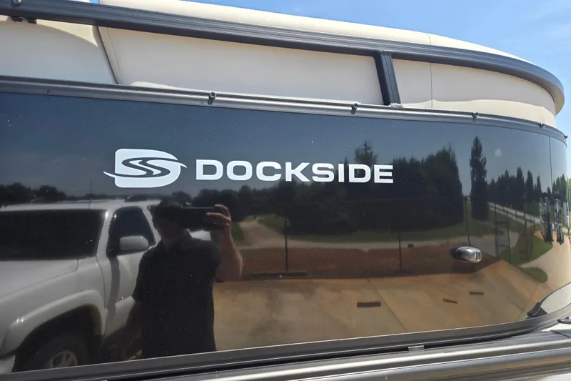 Slide: The Image of 2026 Dockside 22DQ275 boat with logo, reflecting surroundings. - 18
