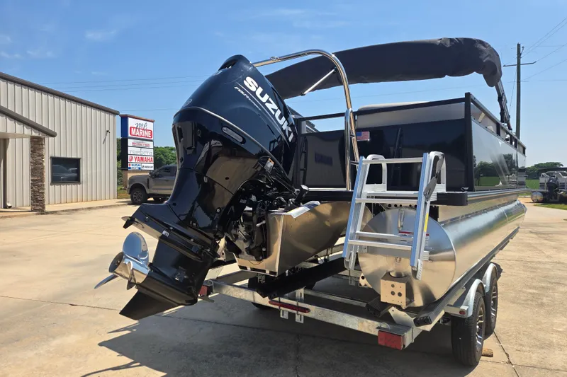 Slide: The Image of 2026 Dockside 22DQ275 pontoon boat with Suzuki outboard motor on trailer. - 16