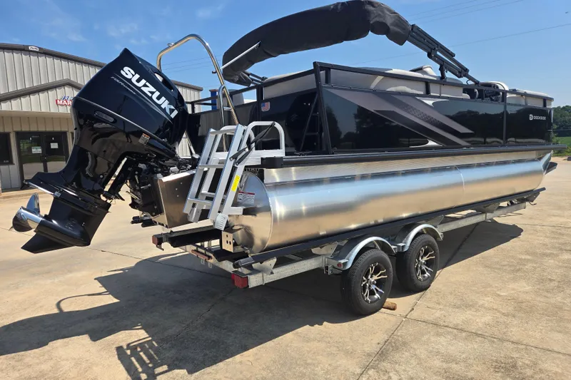 Slide: The Image of 2026 Dockside 22DQ275 pontoon boat with Suzuki outboard motor on trailer. - 17